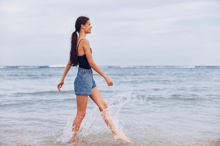 woman happy running beach smile lifestyle summer young sunset sea travel