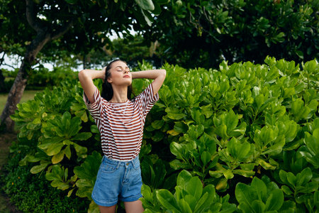 beautiful woman park summer joy nature lifestyle walk t-shirt freedom smilingの写真素材