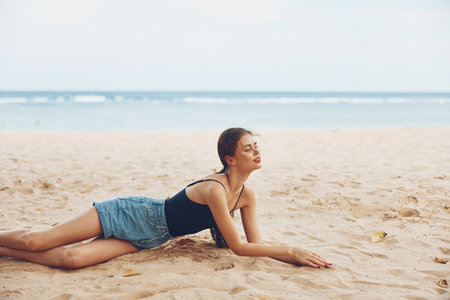 smile woman travel vacation sitting beach freedom tan sea nature sandの写真素材