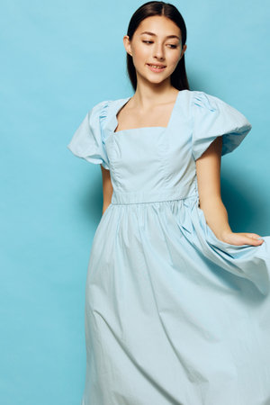 joy woman fashion young model summer studio style dress blue beautifulの写真素材