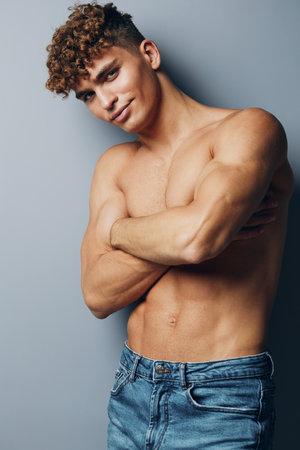 man person gray background healthy studio young guy gray muscle muscular shirtless athleticの写真素材