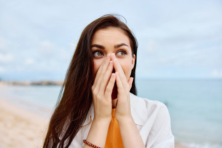 Portrait of a happy woman smile with teeth with long hair brunette summer travel and feeling of freedom, balanceの写真素材