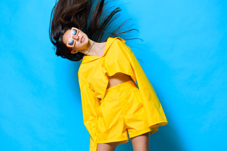 woman lifestyle joy sunglasses attractive yellow girl young beautiful trendy fashionの写真素材