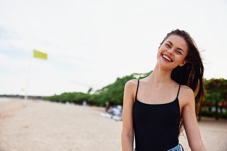 woman young sea nature smile ocean vacation beach summer sand leisureの写真素材