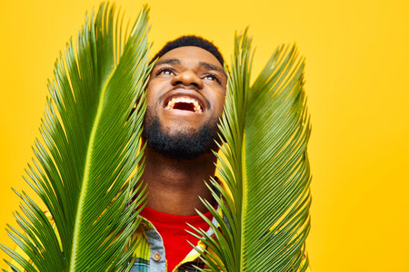 man african stylish black tropical fashion tree expression american yellow happy fun palmの写真素材
