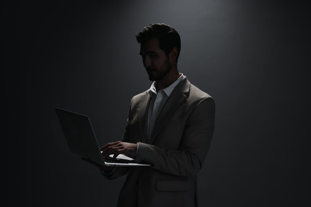 man computer business suit freelancer smiling laptop internet copyspace portrait jobの写真素材