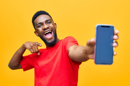 man phone mockup black yellow mobile background hand african happy technology youngの写真素材