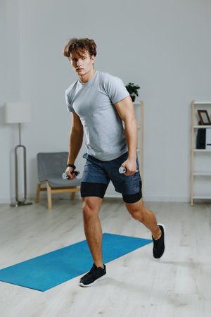 man gray activity home lifestyle sport adult indoor health training dumbbellsの写真素材