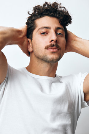 Isolated man casual serious student t-shirt background natural white caucasian fashion hipster portrait lifestyle smileの写真素材