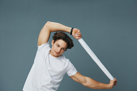 man grey towel body fit full young background sport white lifestyle t-shirtの写真素材