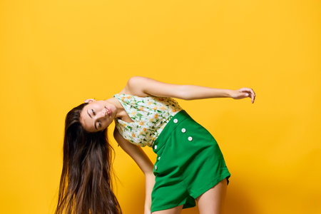 happy woman fashion young emotion model beautiful stylish trendy style yellowの写真素材