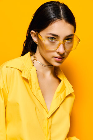 fashion woman girl lifestyle trendy attractive glasses outfit young yellow beautifulの写真素材