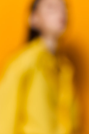 caucasian woman lifestyle girl young attractive fashion model beautiful trendy yellowの写真素材