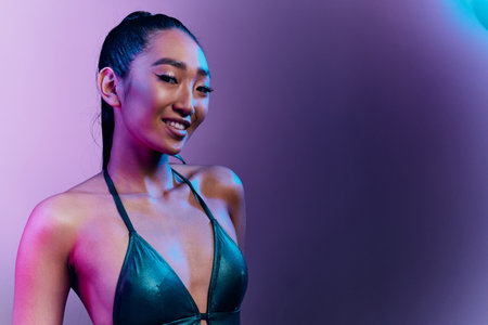 Woman night blue colorful neon beauty light fashion purple disco high vogue pretty trendyの写真素材