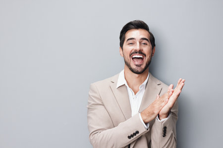 man beige business smiling arm suit copyspace portrait happy handsome businessmanの写真素材