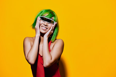 Red woman sunglasses summer excited beauty trendy wig portrait smile fashion swimsuitの写真素材