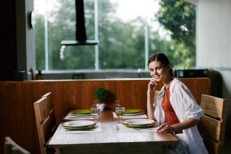 Table dinner beautiful women restaurant dish person cafe food lifestyle adult female meal youngの写真素材