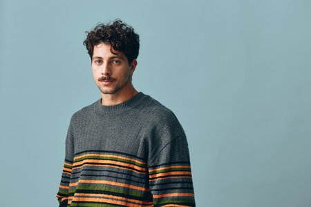 Man attractive handsome gray portrait hipster face trendy sweater copyspace smile fashion