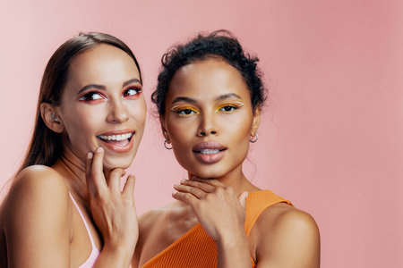 Woman together mixed two model race make-up beauty happy studio skin colorful
