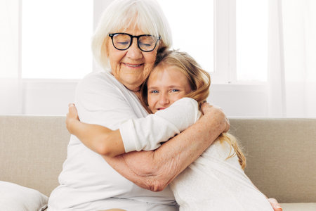 Home grandmother family child sofa girl couch granddaughter love happy