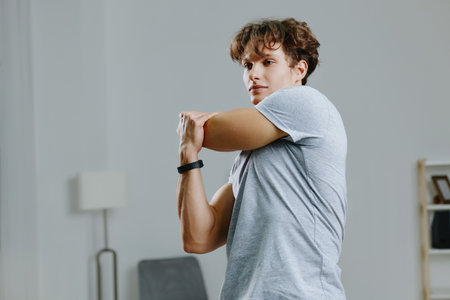 man sport home quarantine training activity dumbbells lifestyle indoor gray healthの写真素材