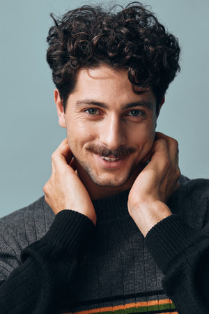 Portrait man one face sweater fashion cheerful gesture handsome trendy copyspace happy hipster smileの写真素材