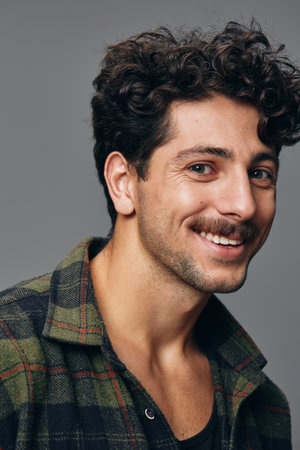 Fashion man trendy smile cheerful handsome portrait hipster shirt copyspace faceの写真素材