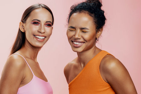 Woman make-up model happy together beautiful skin studio race mixed beauty colorful twoの写真素材