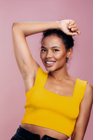 Creative woman face black beauty portrait make-up colourful african beautiful yellow smileの写真素材