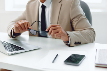 Person man young book business businessman write corporate pen suit plan hands desk document