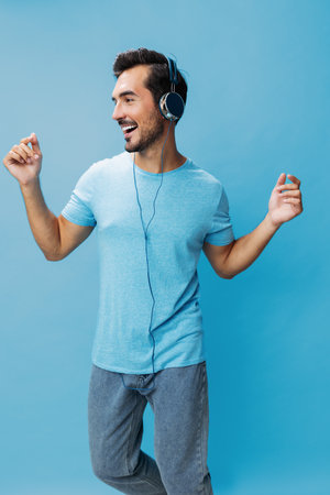 T-shirt man online headphone music happy portraitの写真素材