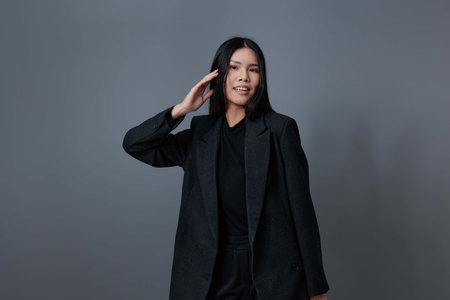 Woman brunette trendy asian beautiful fall coat smileの写真素材