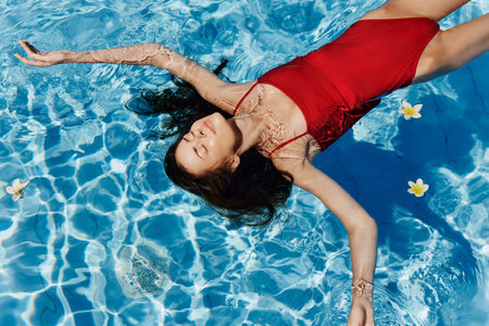 Summer woman pool female vacation waterの写真素材
