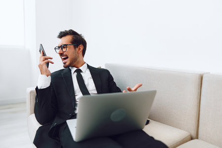 Man talk phone businessman office laptopの写真素材