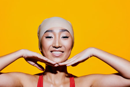 Hand woman smile red trendy beauty portrait fashion yellow joy surprised lifestyleの写真素材