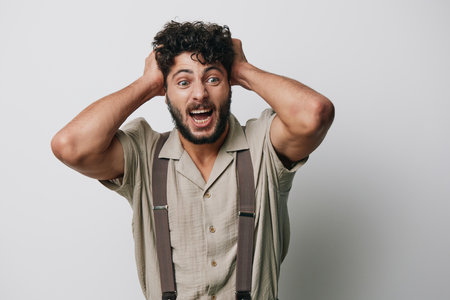 Man isolated young portrait expression person white guy male happy face model adult background studioの写真素材