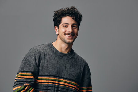 Fashion man sweater portrait hipster face copyspace trendy cheerful standing handsome smileの写真素材