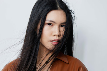 Hair woman asian beautiful fashion glamour cosmetic beige beauty model portraitの写真素材