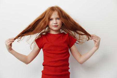 Kid little person female girl child portrait face young childhood caucasian beautyの写真素材