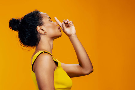 Creative woman beauty black beautiful make-up african face colourful smile yellow portraitの写真素材