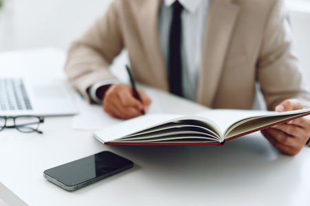 Man businessman write hands plan business deskの写真素材