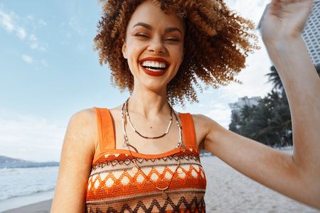 Smiling Woman on Beach: Happy Hippie Traveler Enjoying Freedom and Natureの写真素材