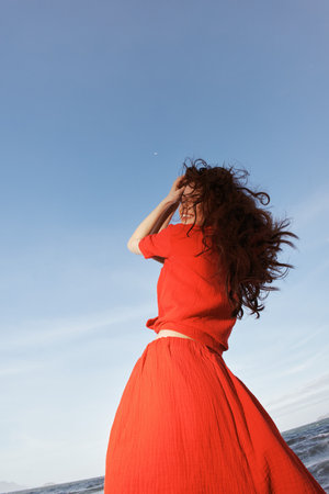 Smiling Woman Enjoying Freedom on Sunny Beach - a Vibrant Portrait of Joyful Summer Funの写真素材