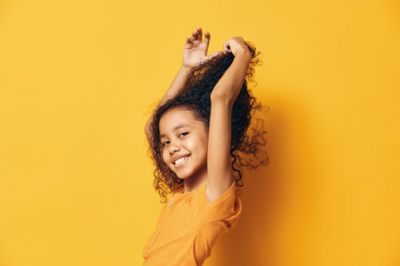 Woman female afro young hair curly smile background african black model face person woman happyの写真素材