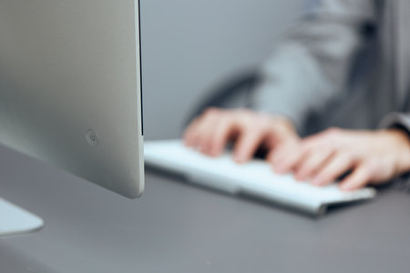 Modern Technology in the Business World: A Collection of Images Showcasing Professionals Using Laptops for Productive Workの写真素材