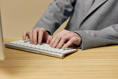 Businessperson typing on keyboard