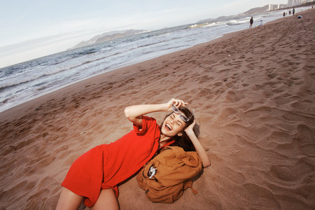 Joyful Backpacker: Embracing Freedom and Adventure in the Beautiful Nature of a Tropical Islandの写真素材