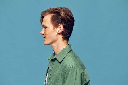 The Handsome Blue-Eyed Model: Portrait of a Confident Young Man in Casual White Shirt
