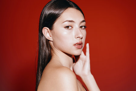 Natural Beauty: Young Womans Attractive Face with Clean and Clear Skin, Sensual Lips, and Perfect Makeup, Expressing Health and Wellness in a Fashionable and Stylish Portrait.の写真素材