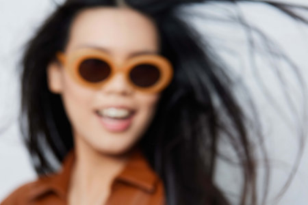 Cosmetic woman sunglasses beige beautiful portrait vacations lifestyle model glamour asian beauty fashion hairの写真素材